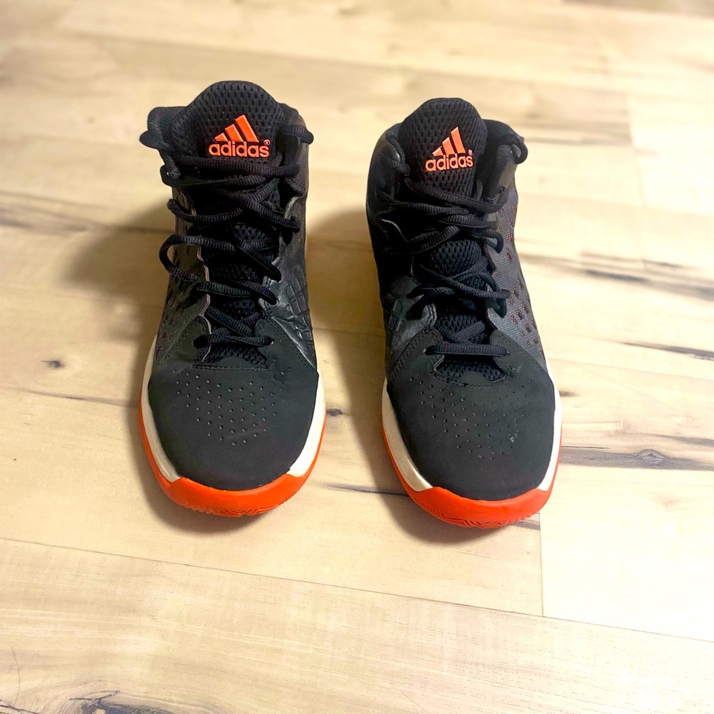 Adidas mid top basketball shoes.
